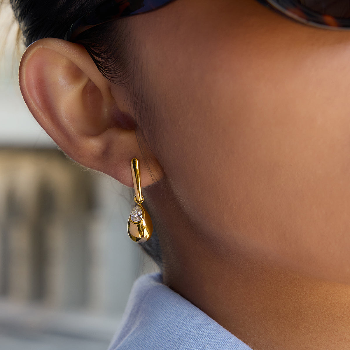 Alba Earrings in gold worn
