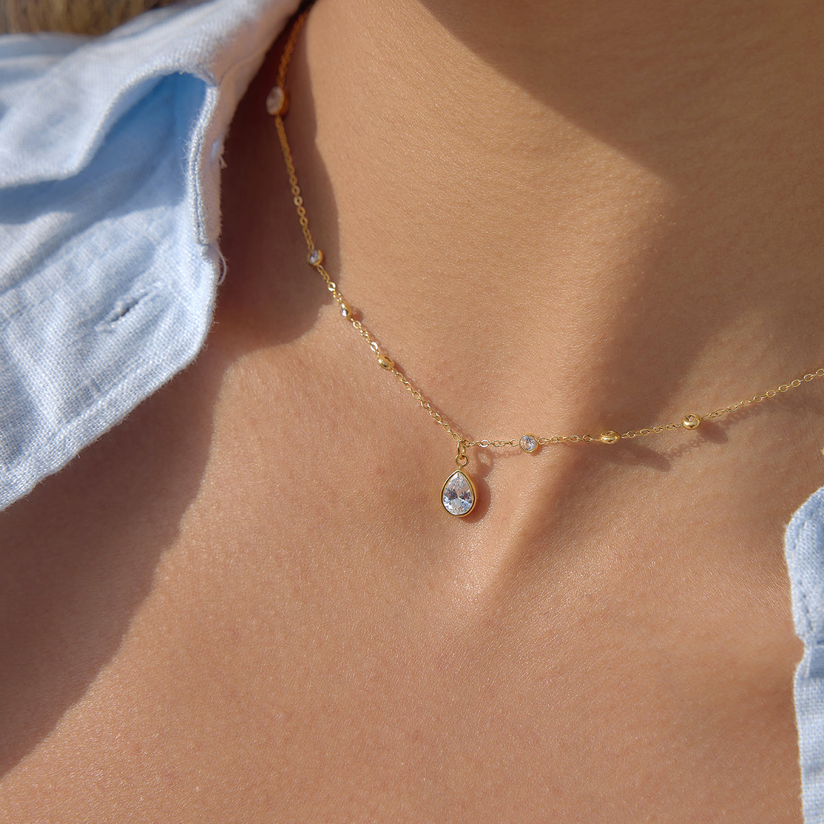 Delia Chain in gold worn