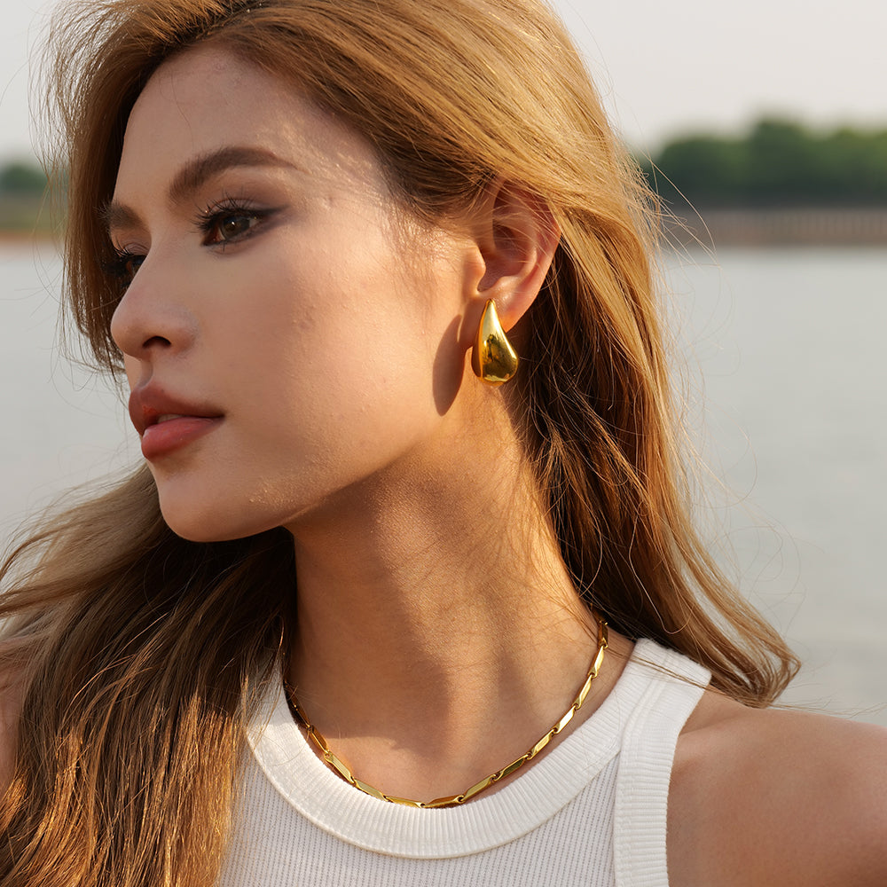 Dewdrop Studs in Gold worn by a model