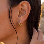 Diamond Bridge Hoops in gold worn close-up