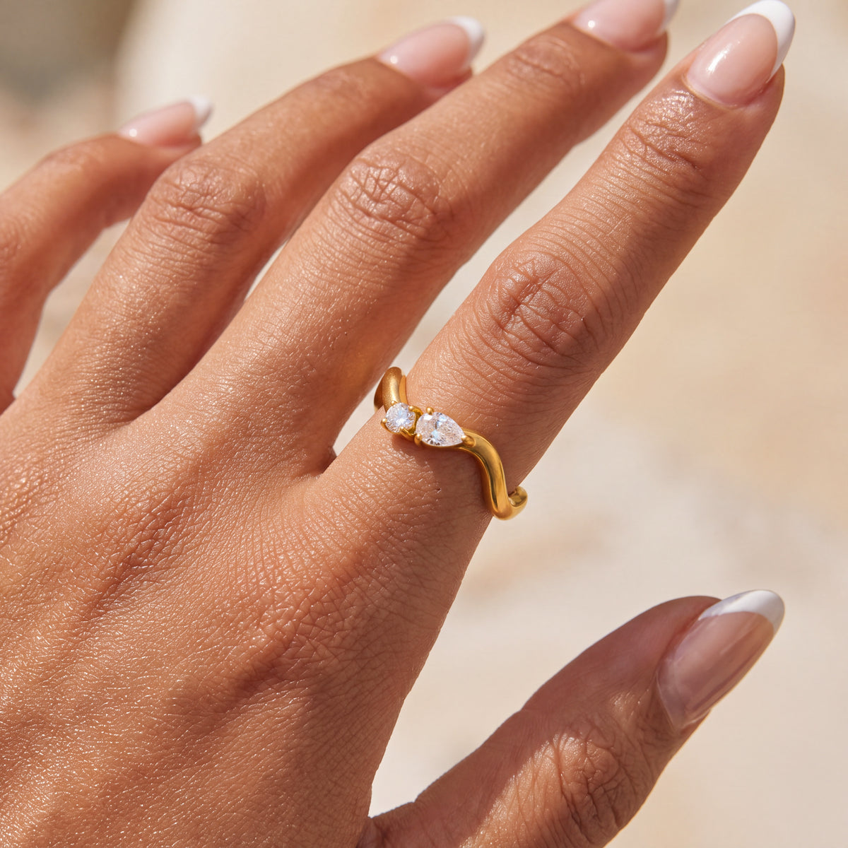 Diamond Wave Ring in gold worn on hand