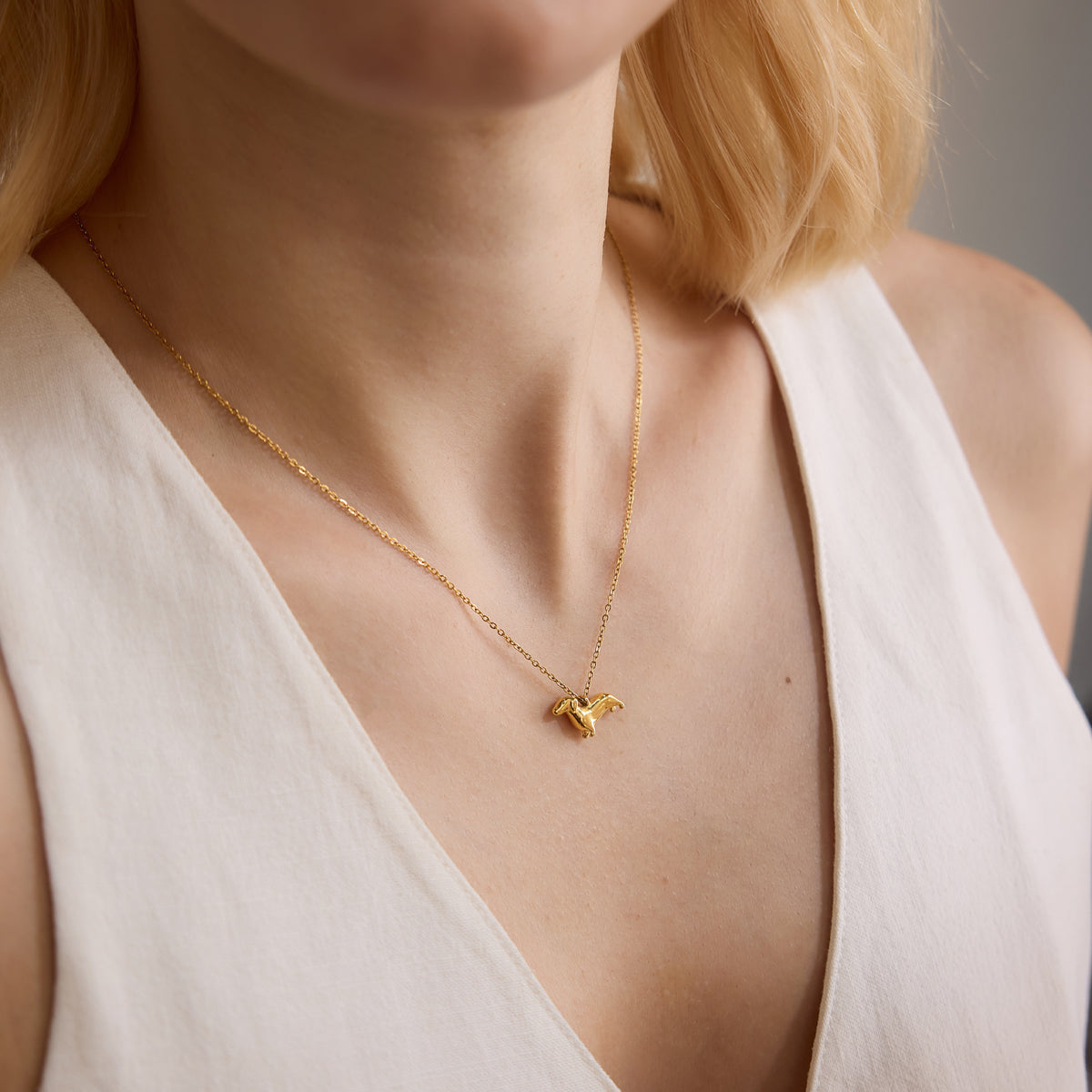 Doxie Chain in gold worn