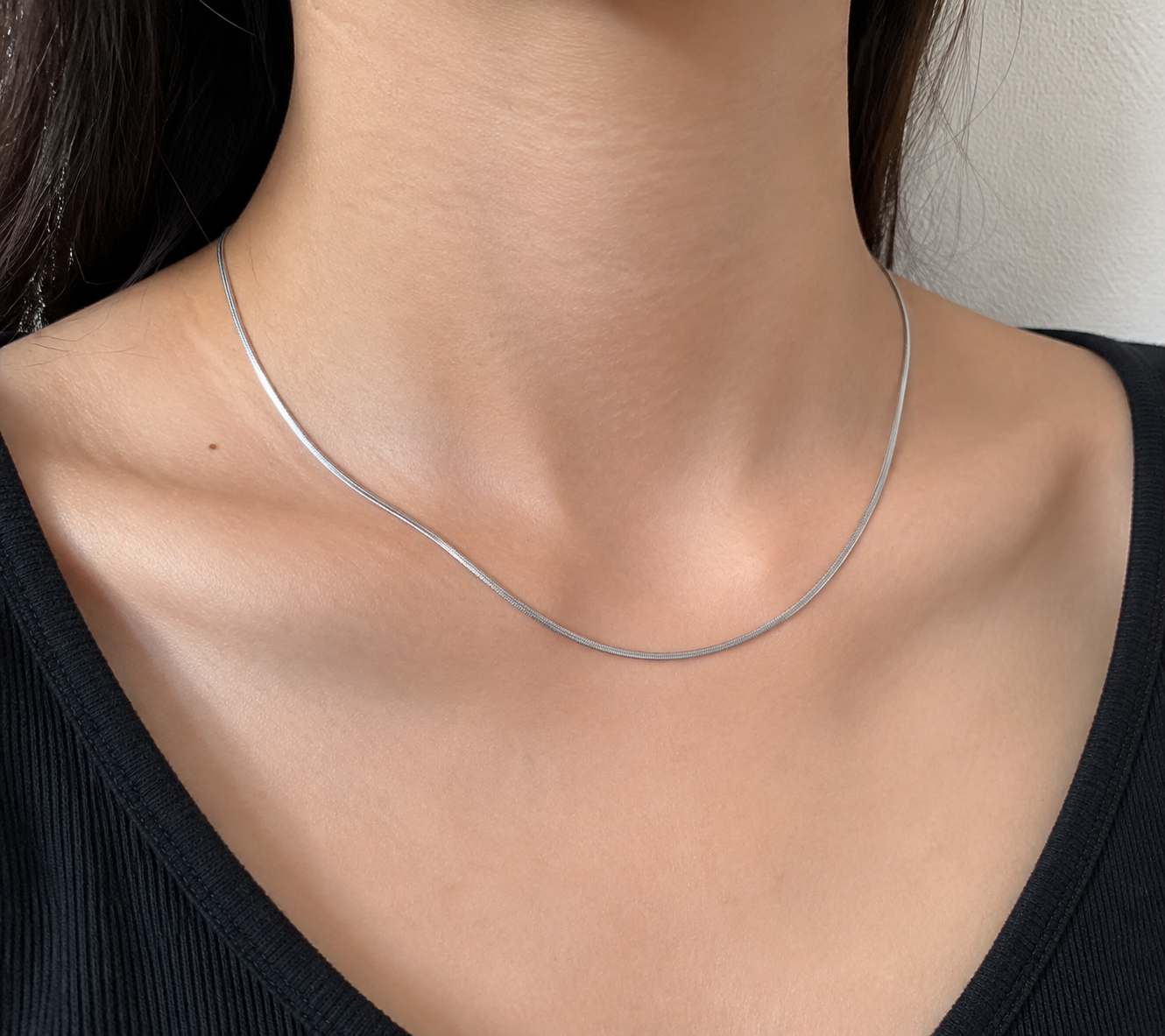 Micro Flat Chain in Silver, close-up on skin