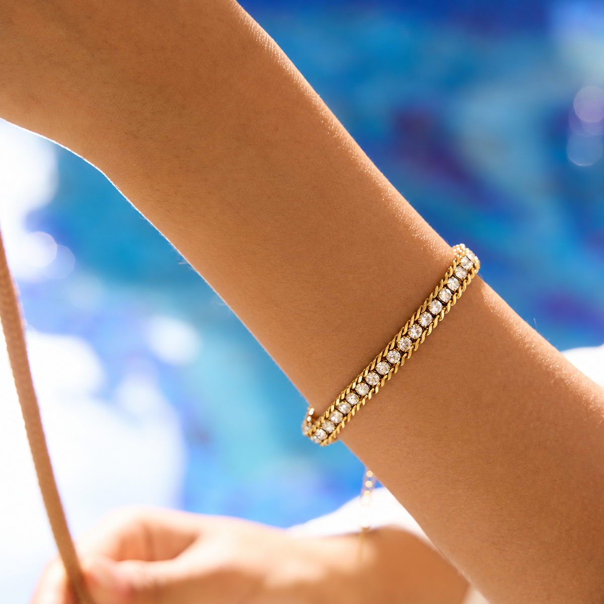 Gleam Bracelet in gold worn alone on wrist