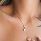 Halo Drop Chain in gold worn close-up