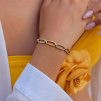 Lia Bracelet in gold worn alone on wrist