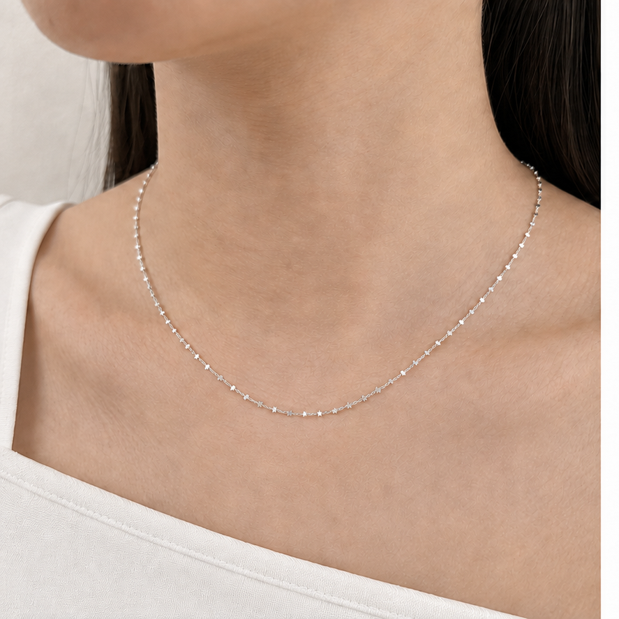 Mini Star Chain in Silver worn in a close-up model view