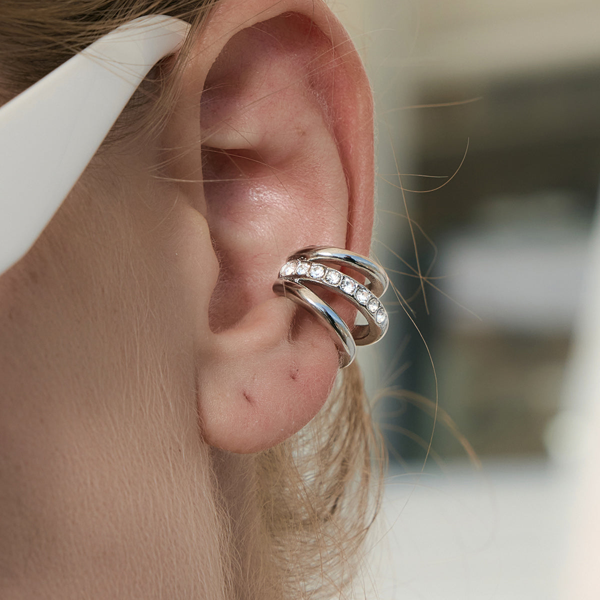 Rebel Ear Cuff in silver worn close-up