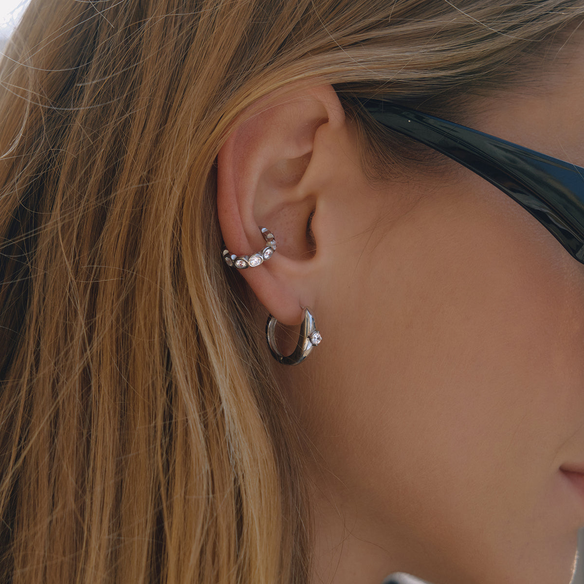 Sol Ear Cuff in silver styled on ear