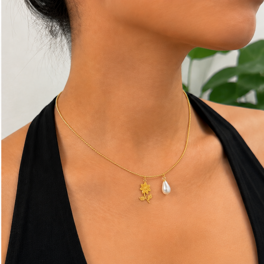 Thin Bead Chain in Gold styled with two charms on a model