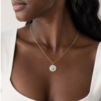Thin Link Chain in Gold styled with one charm on a model