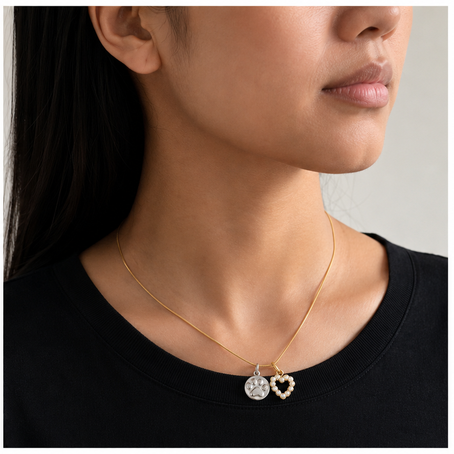 Thin Snake Chain in Gold styled with two charms on a model