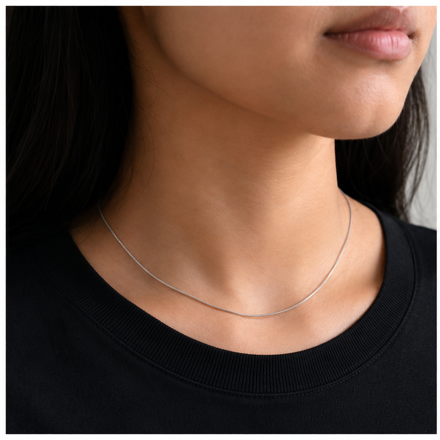 Thin Snake Chain in Silver worn in a close-up model view
