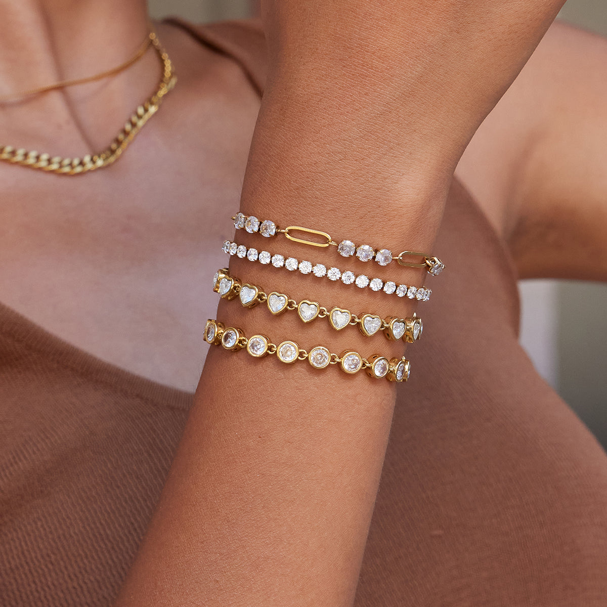 Thin Tennis Bracelet in silver worn in a wrist stack