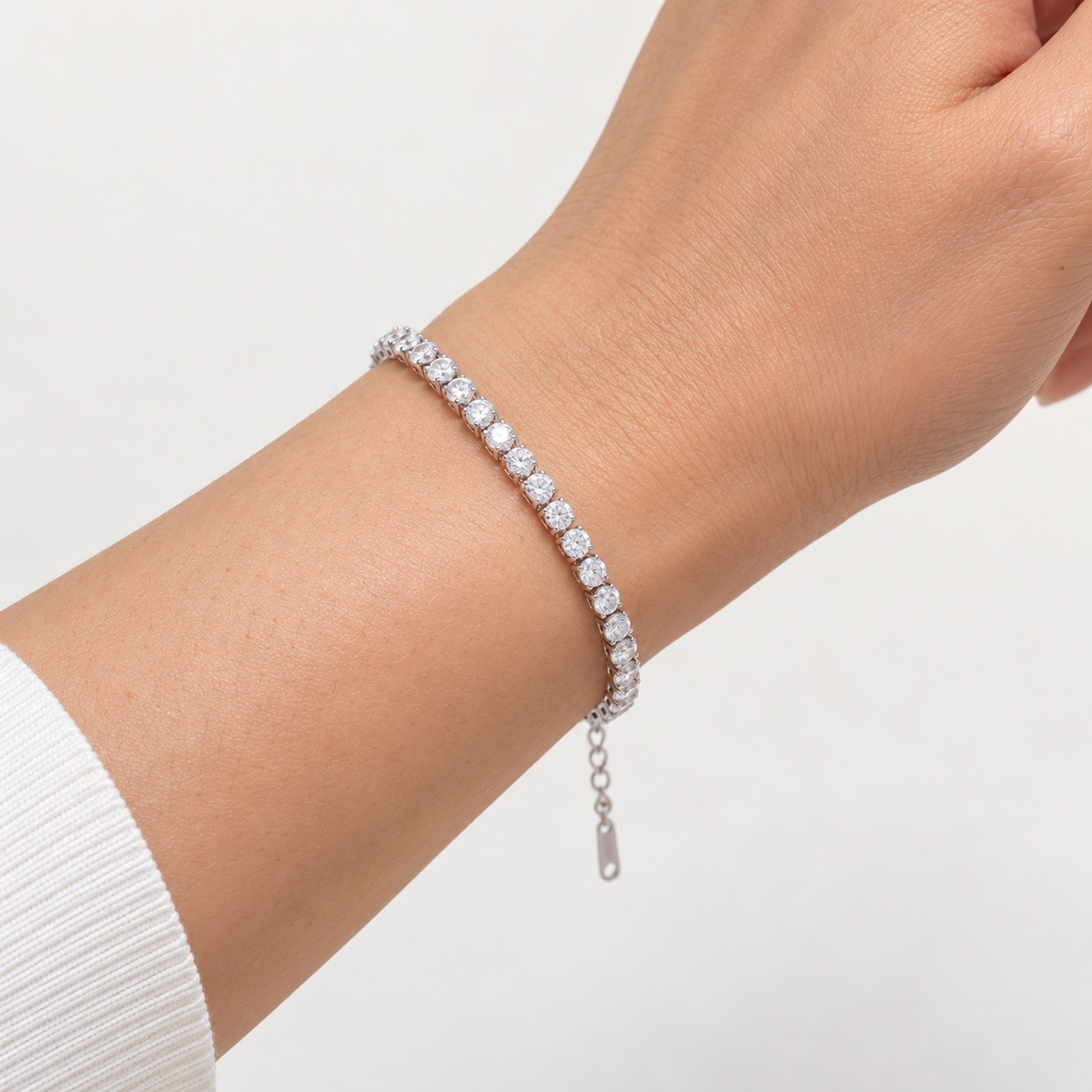 Thin Tennis Bracelet in silver worn alone on a wrist