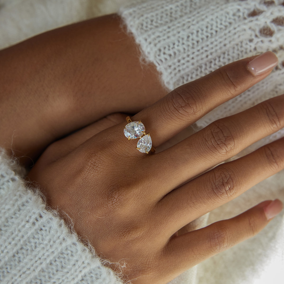 Twin Star Ring in gold worn in a wider hand view