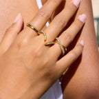 Vivi Ring in gold worn in a mixed jewellery stack