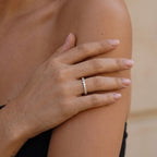 William Ring in gold worn in an editorial hand pose